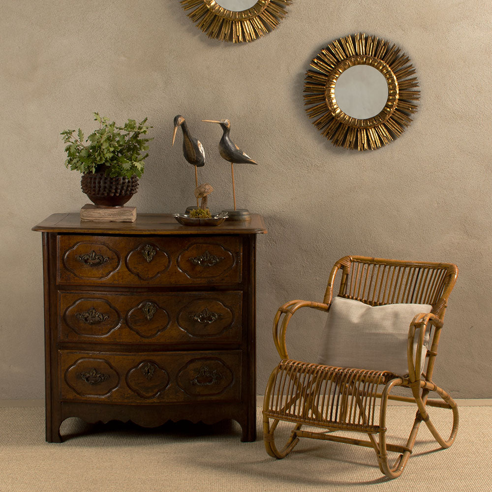 Antique French commode wicker armchair sunburst mirrors