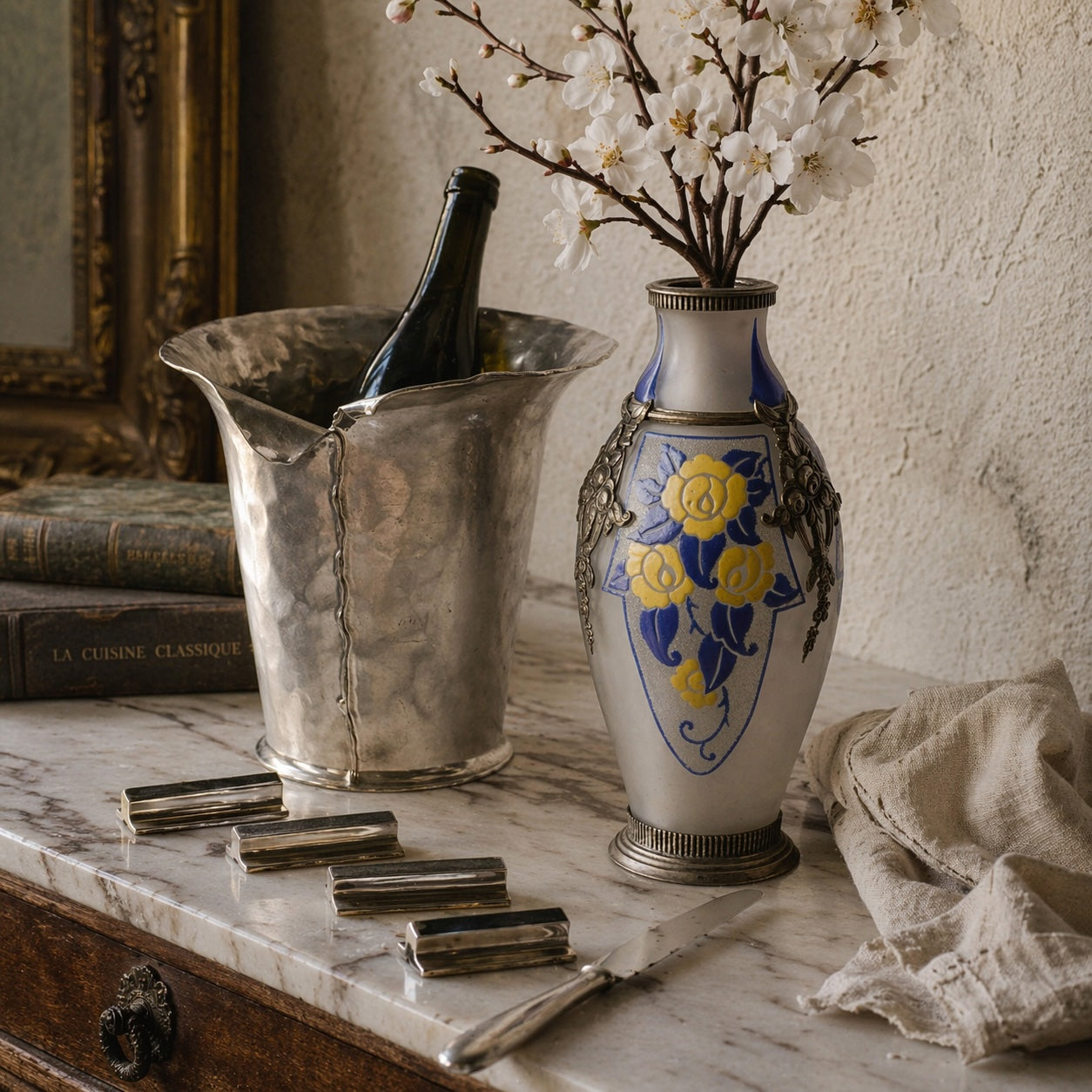 Antique French gift collection with a champagne bucket, knife rests, and frosted glass vase