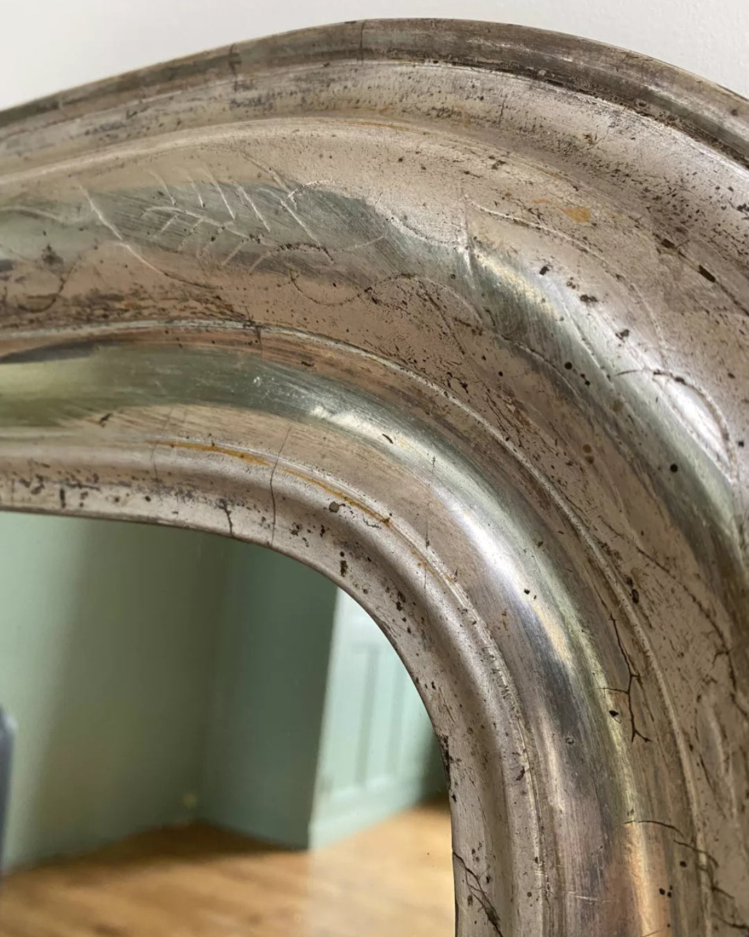 Red-hued patina mirror