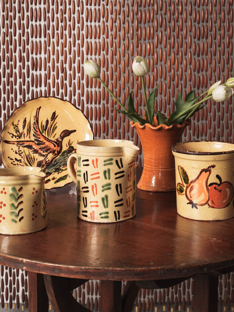 Charming rustic fruit-decorated jar