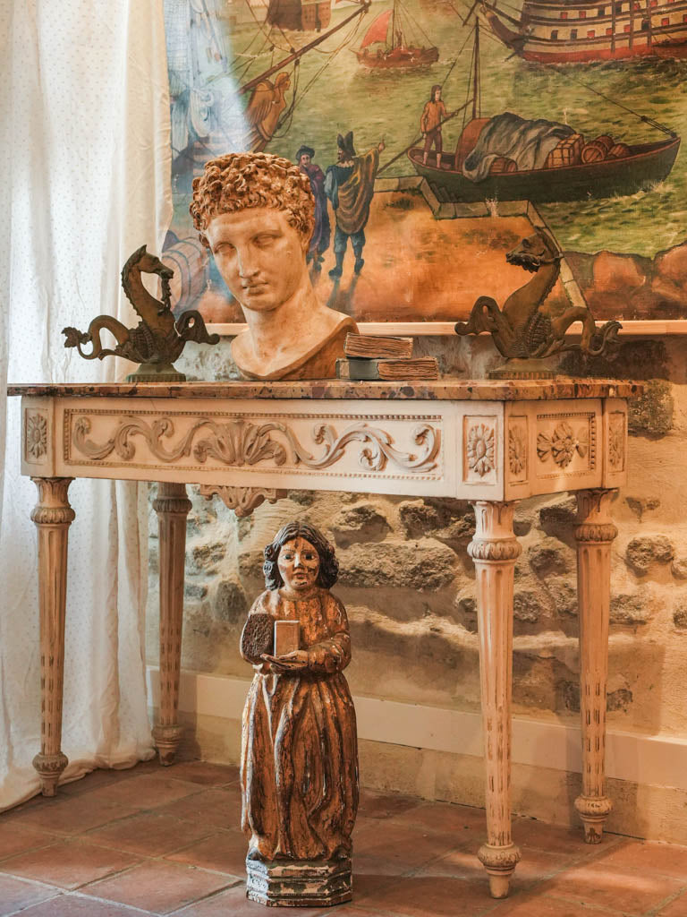Timeworn narrative canvas with ships.
