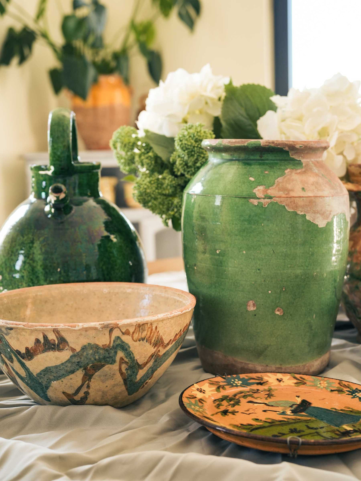 Timeworn green-glazed pottery vessel