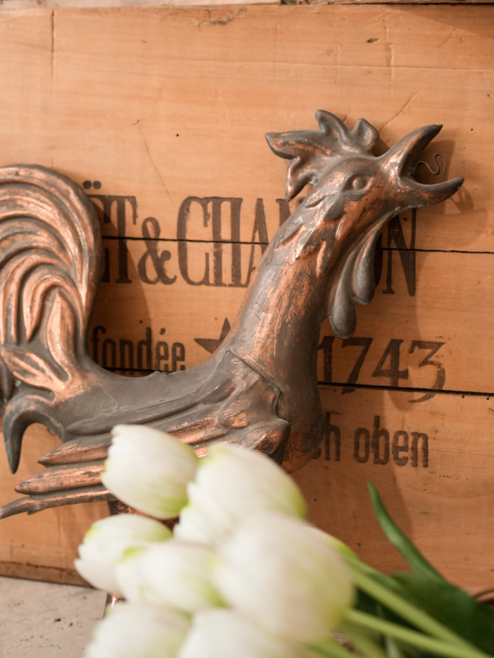 Luminous antique rooster artifact