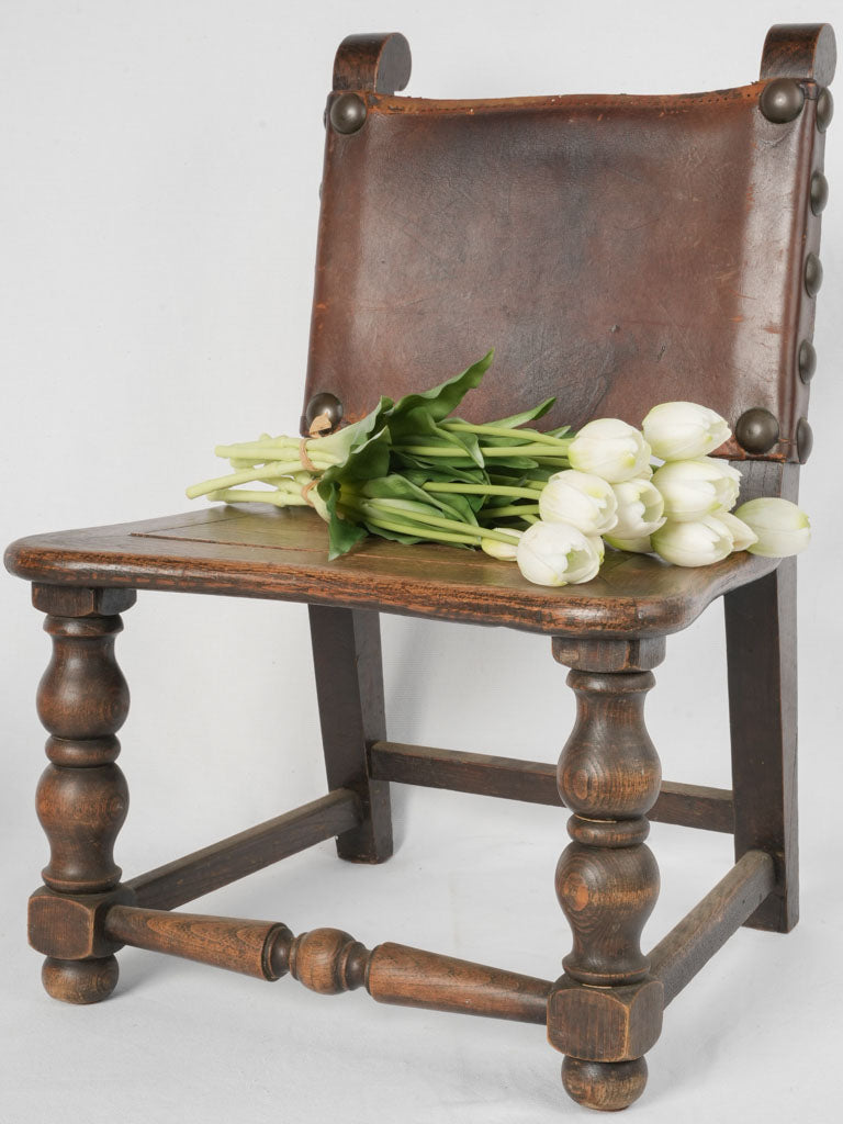 Sturdy aged leather oak chair