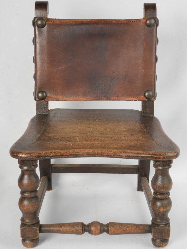 Aged solid oak leather chair