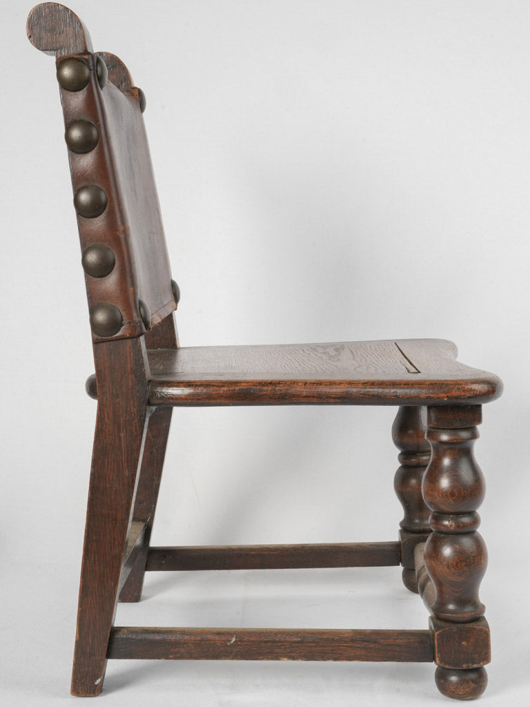 Robust aged oak armchair