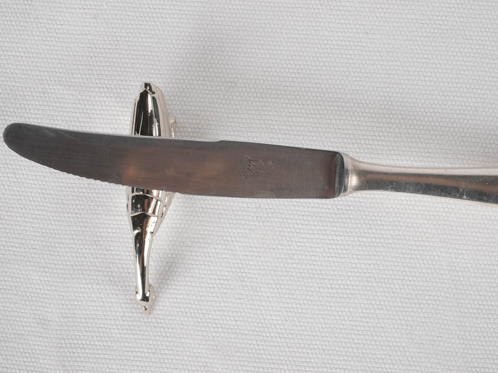 Refined metallic knife rest collection