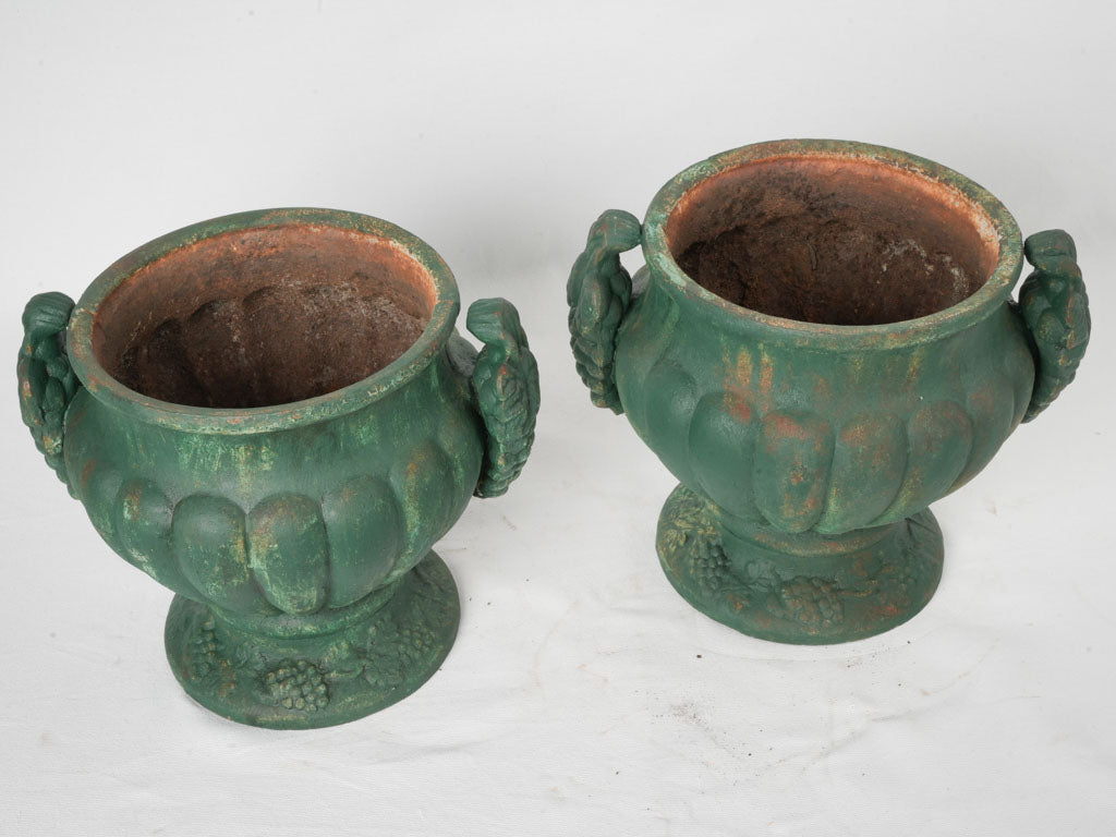 Elegant vine adorned cast iron planters