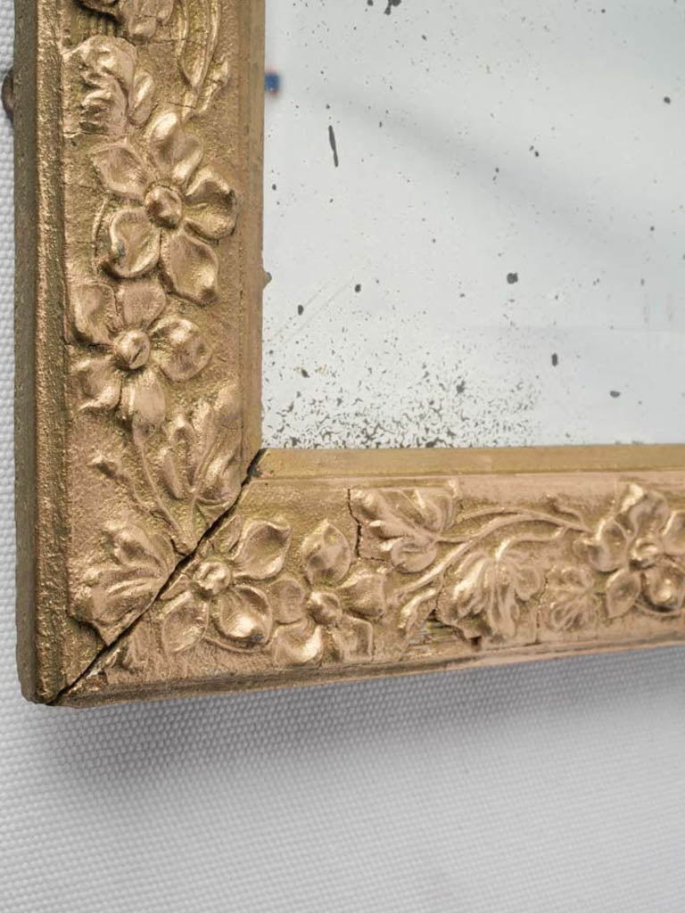 Charming patinaed gilded mirror