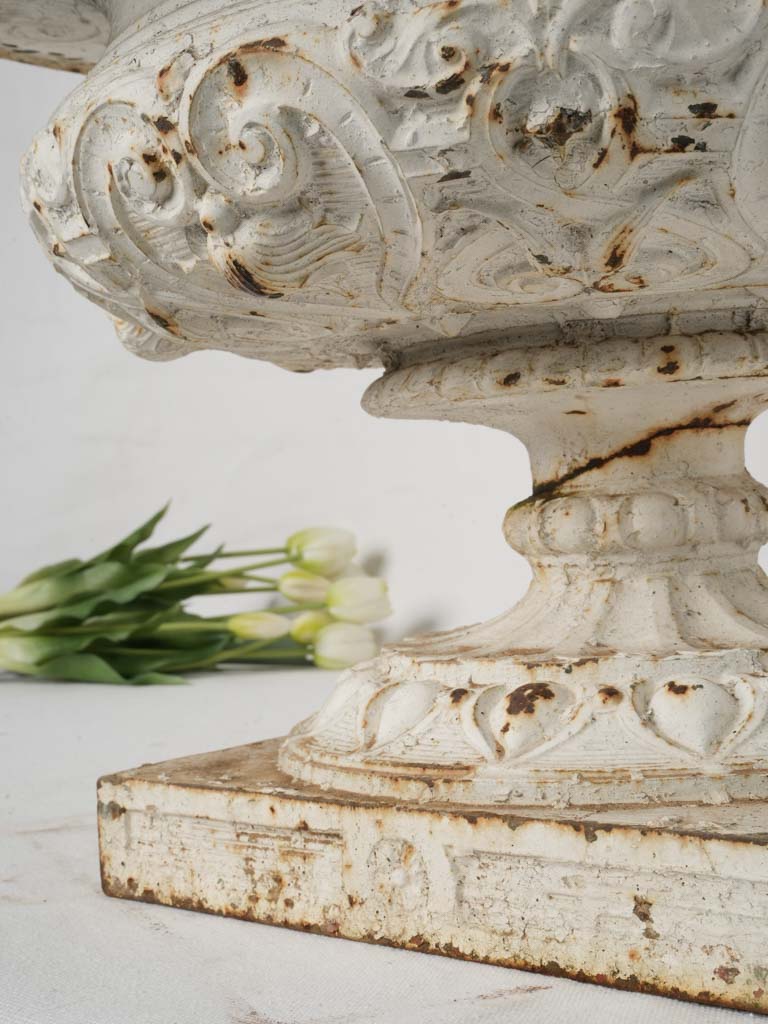 Artistic embellished cast iron urns