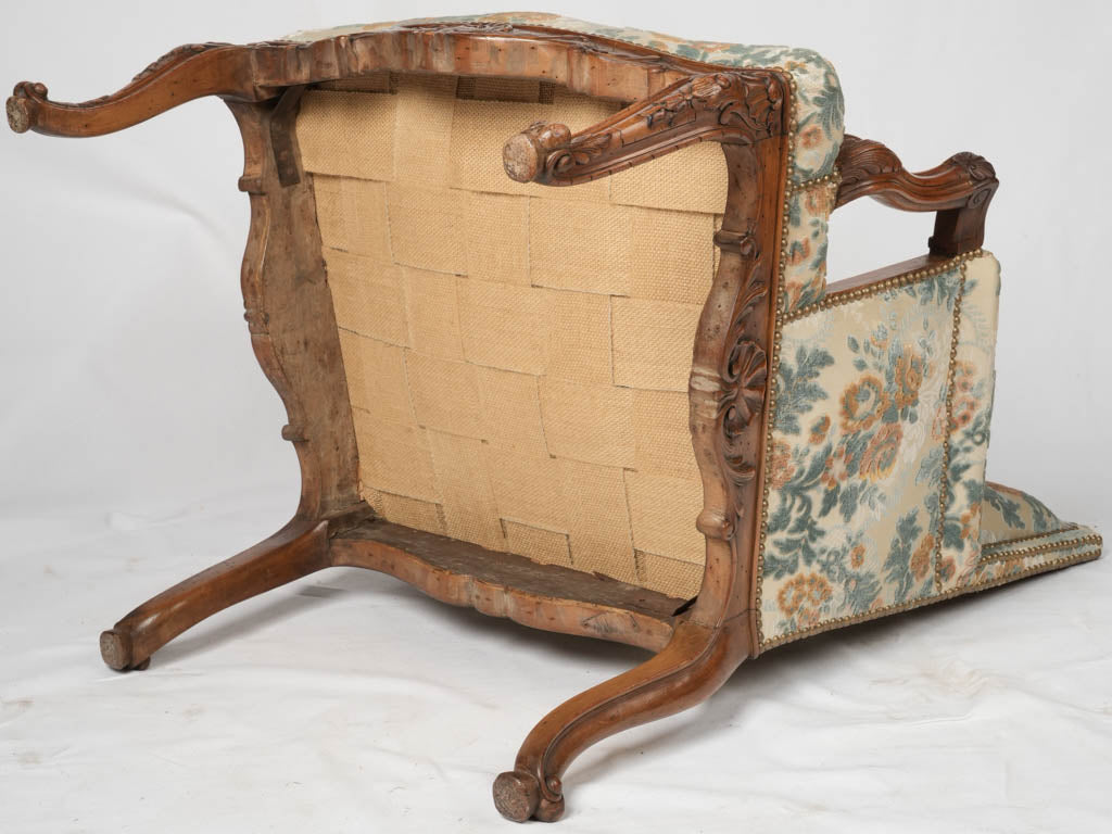 Delicate Parisian walnut armchair with sculpted details