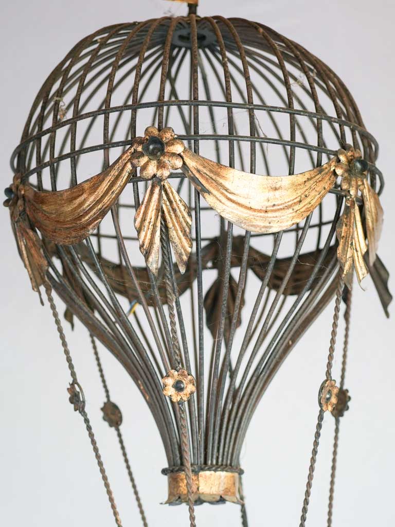 Whimsical vintage iron daisy chandelier