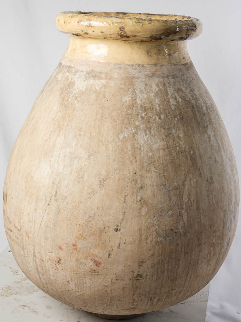Aged yellow ceramic garden urn