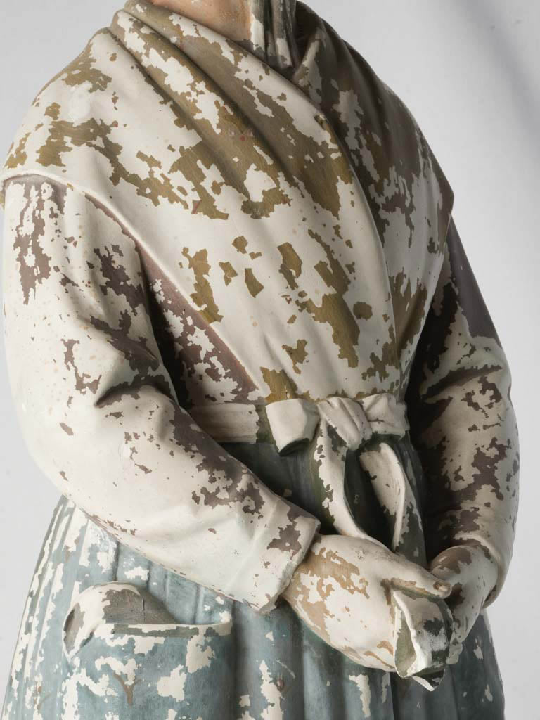 Aged traditional farm attire statues