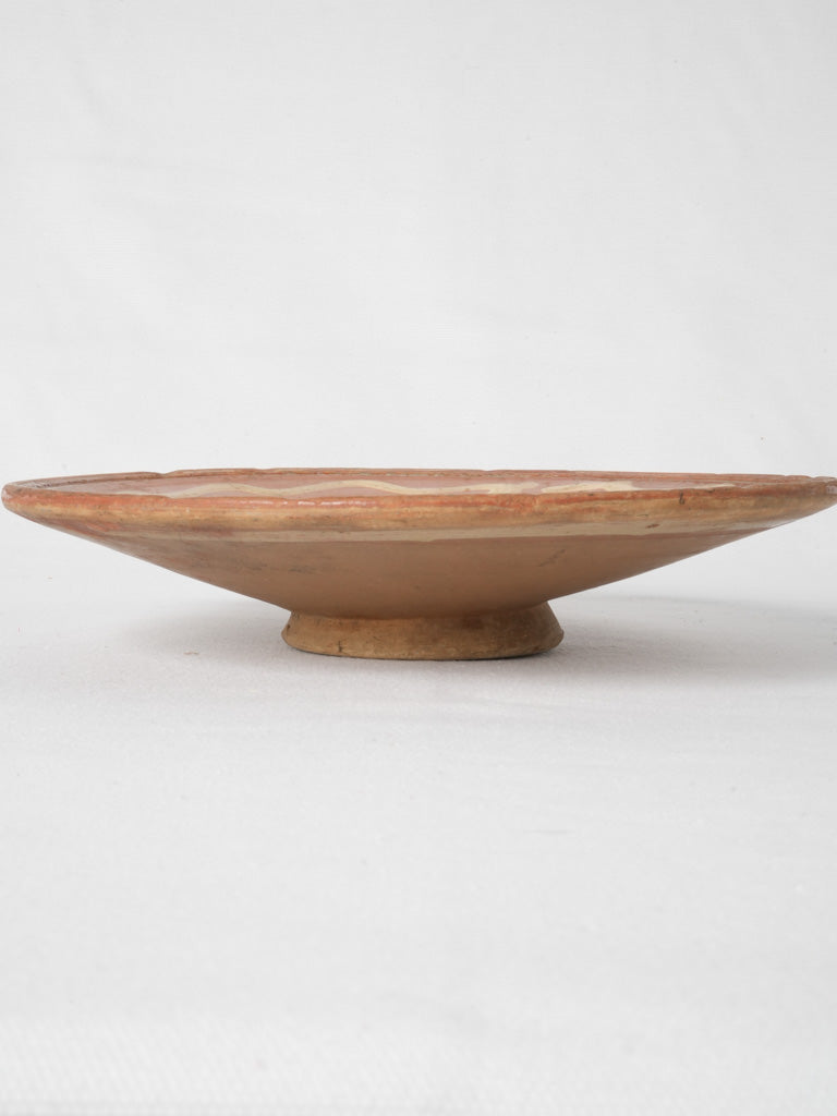 Ochre-colored decorative footed plate