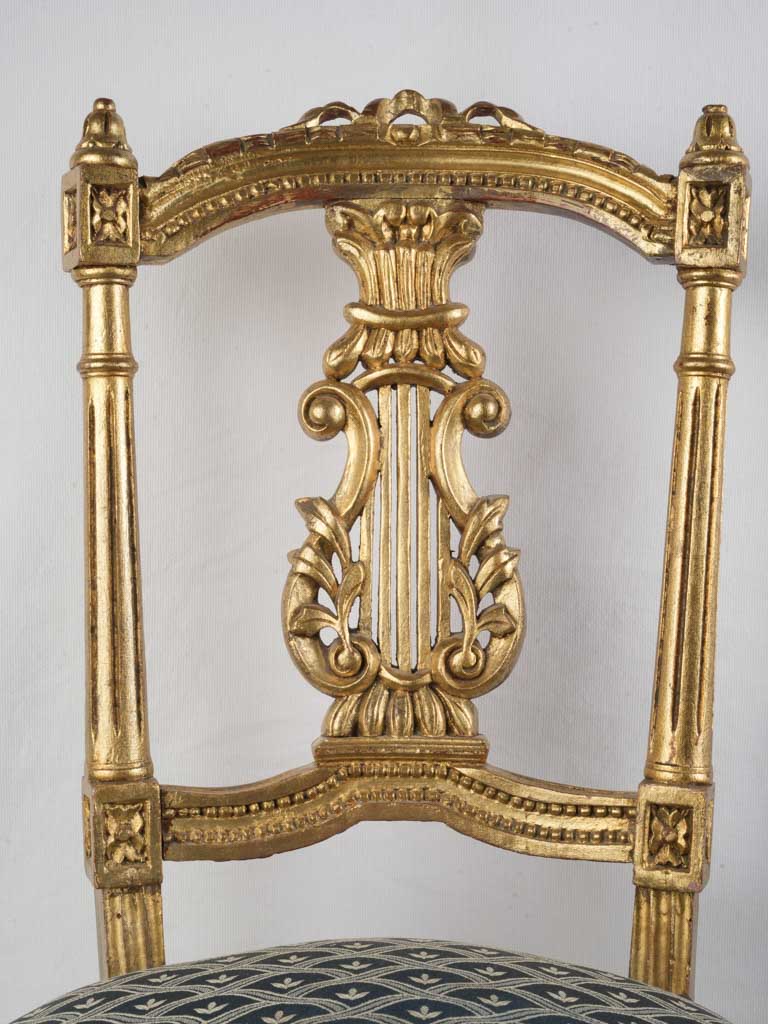 Lustrous gold-finished French chairs