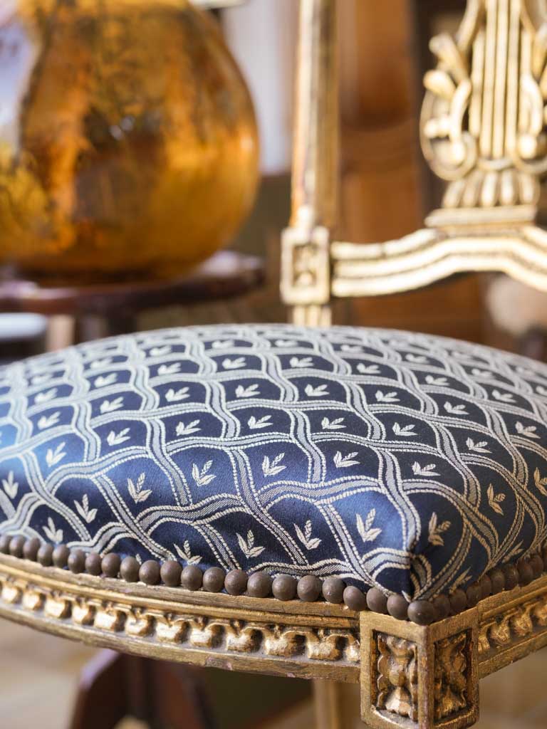Richly carved gilded side chairs