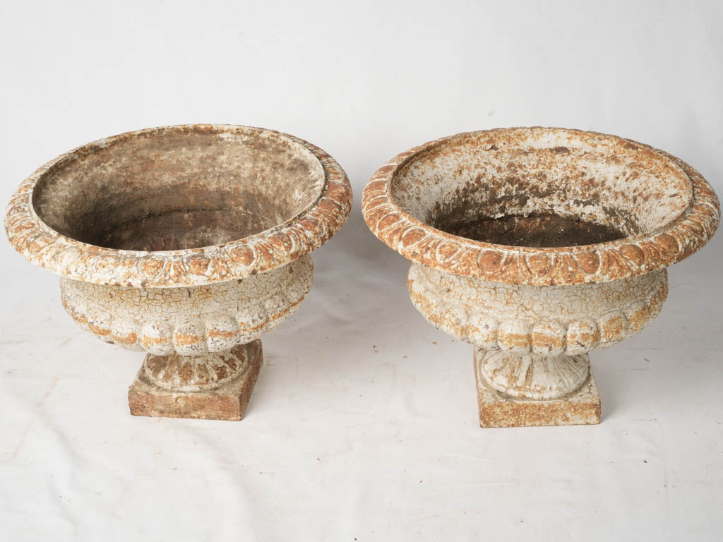 Aged white decorative garden vases