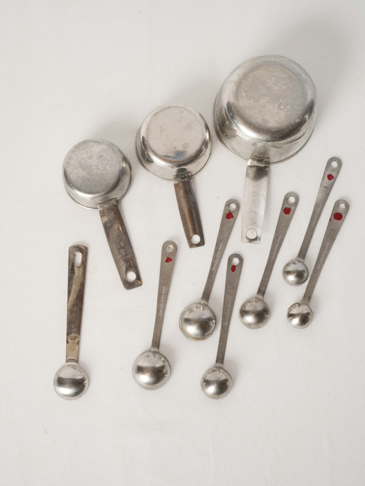 Vintage French Stainless Steel Measuring Cups with Peg Rails