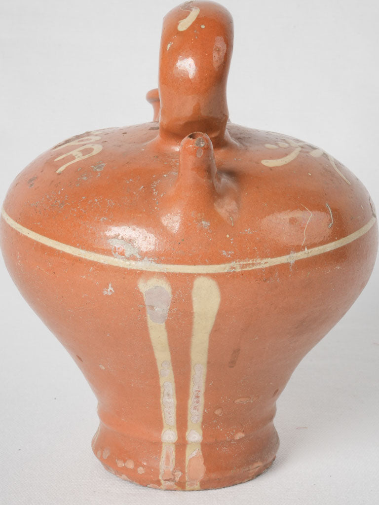 Playful yellow glazed water jug