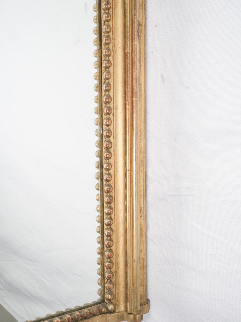 Decorative ribbon and bow crest mirror