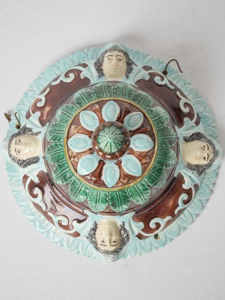 Antique French barbotine hanging pot with faces