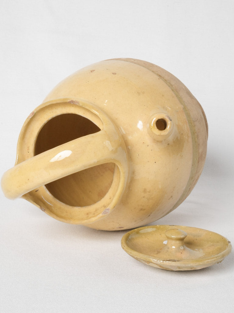 Time-worn pale yellow glaze cruche