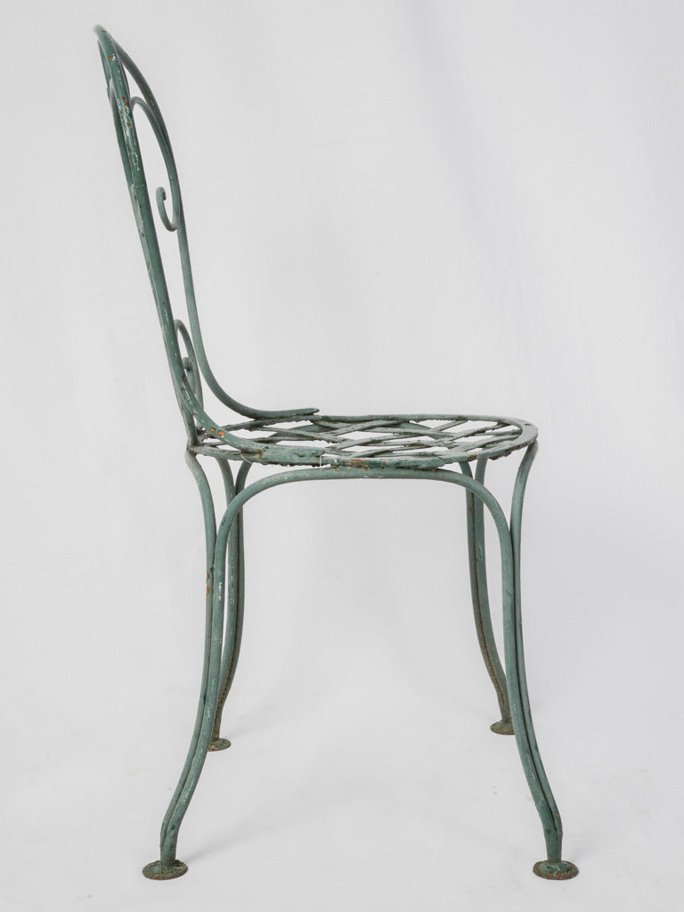 Timeworn paint wrought iron furniture