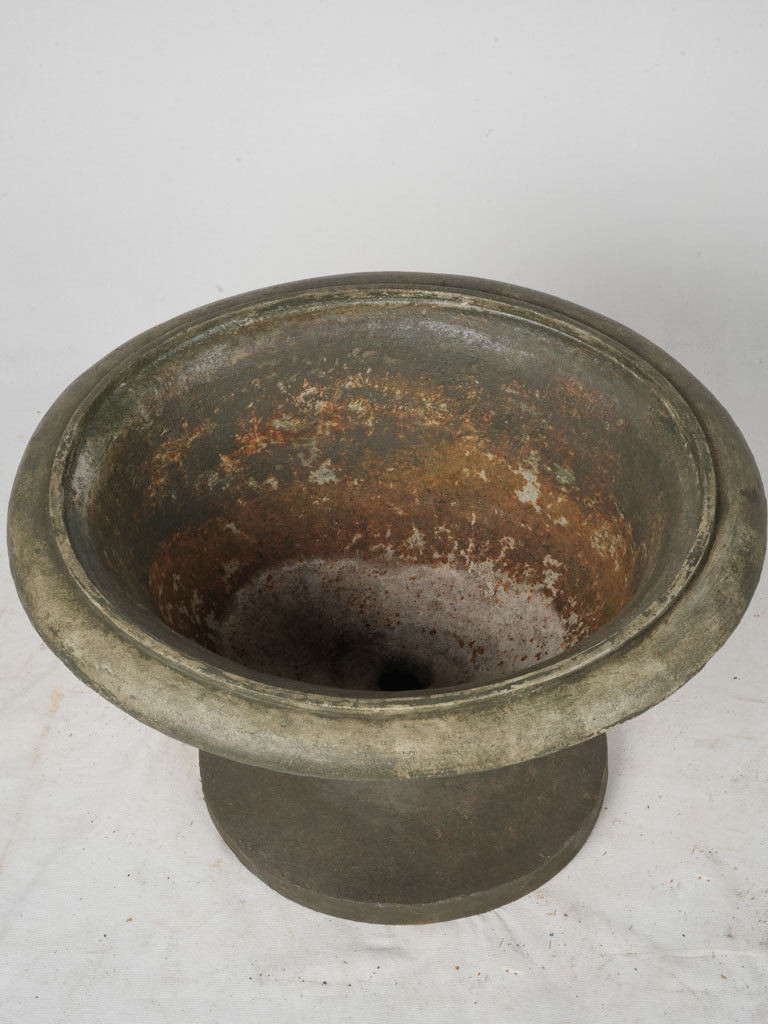Rustic iron urn with patina