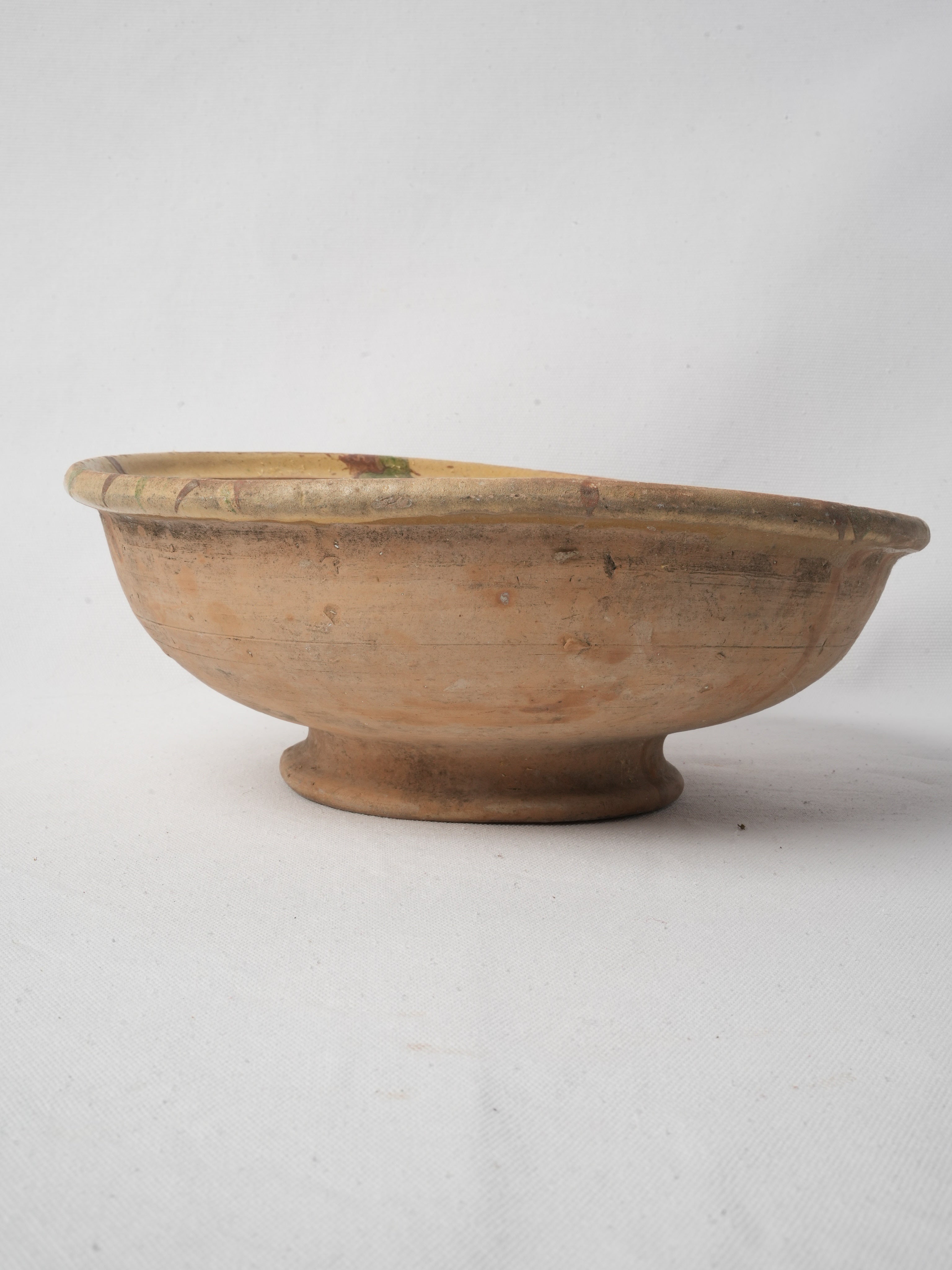 Timeworn patina terracotta vessel