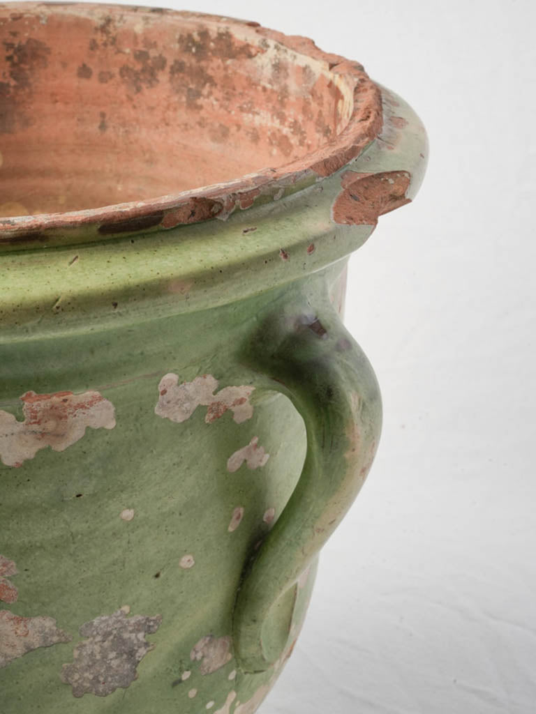 Weathered green-glazed planter urn