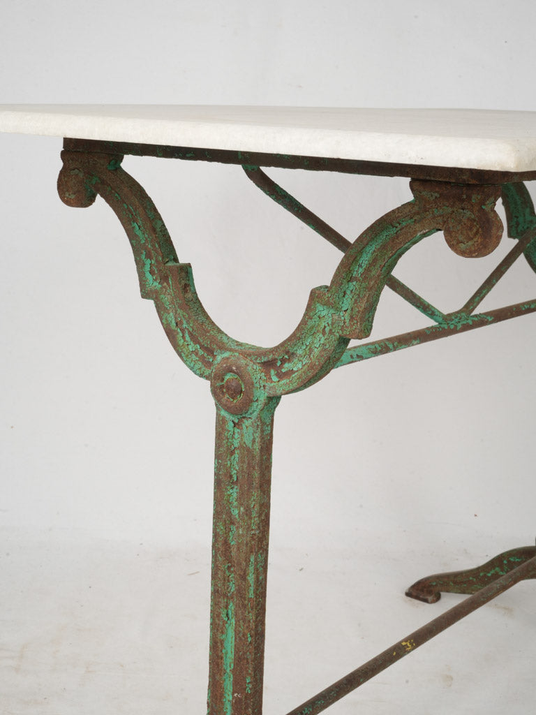Elegant scrolled iron table.