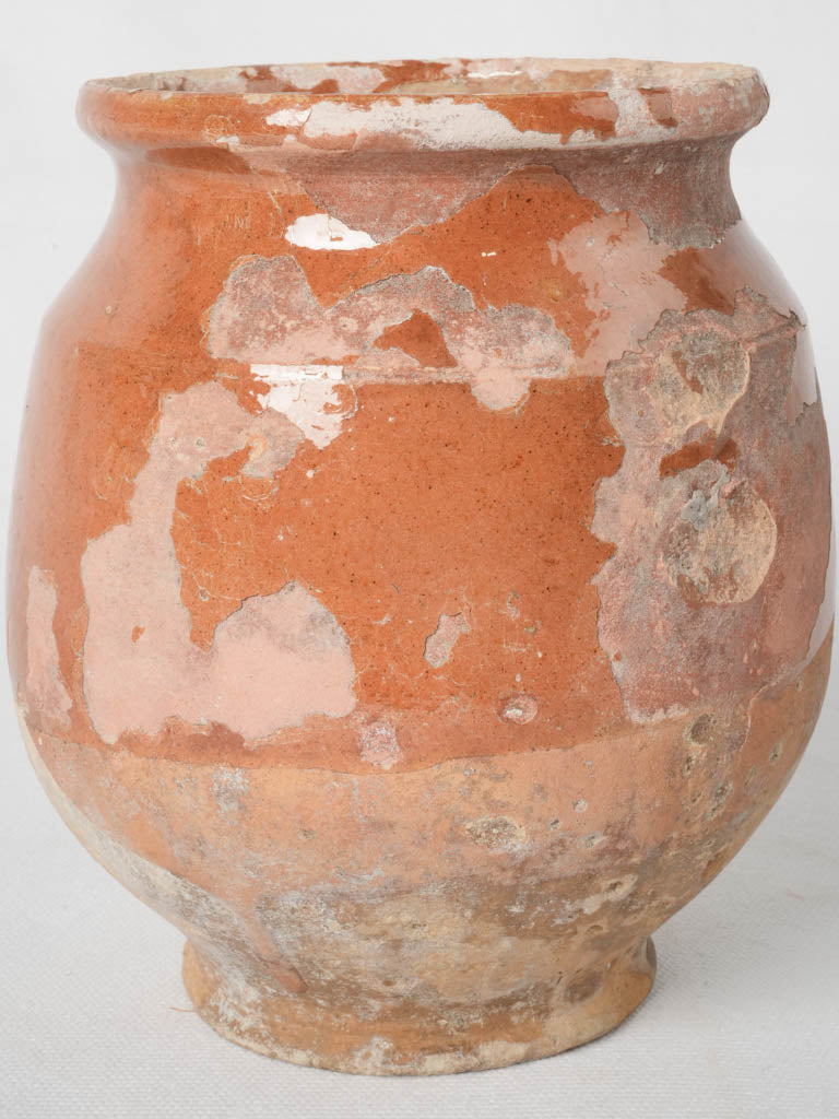 Aged timeworn round terracotta pot