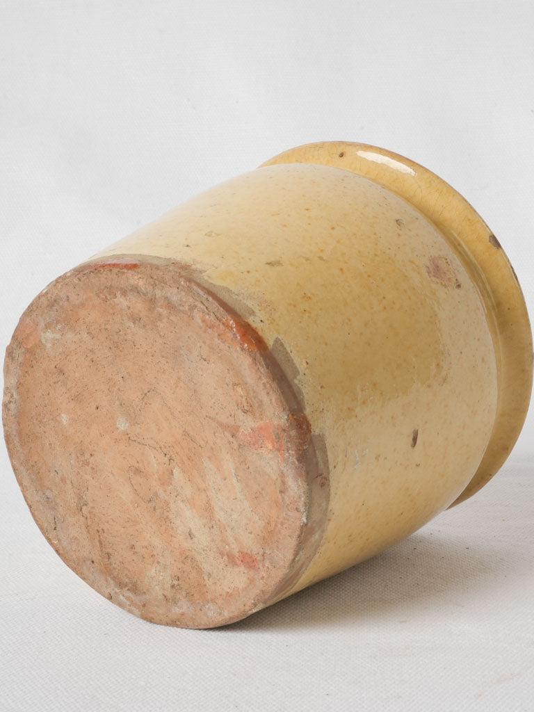 Aged sunny yellow French glazed container