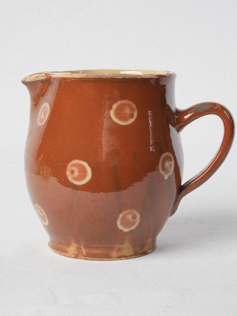 Early 20th-century dotted pottery jug
