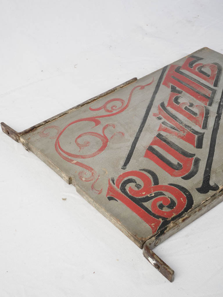 Weathered wooden buvette sign
