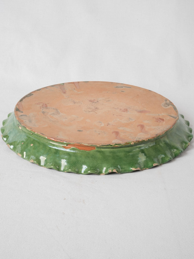 Aged French mountain living scalloped edge plate