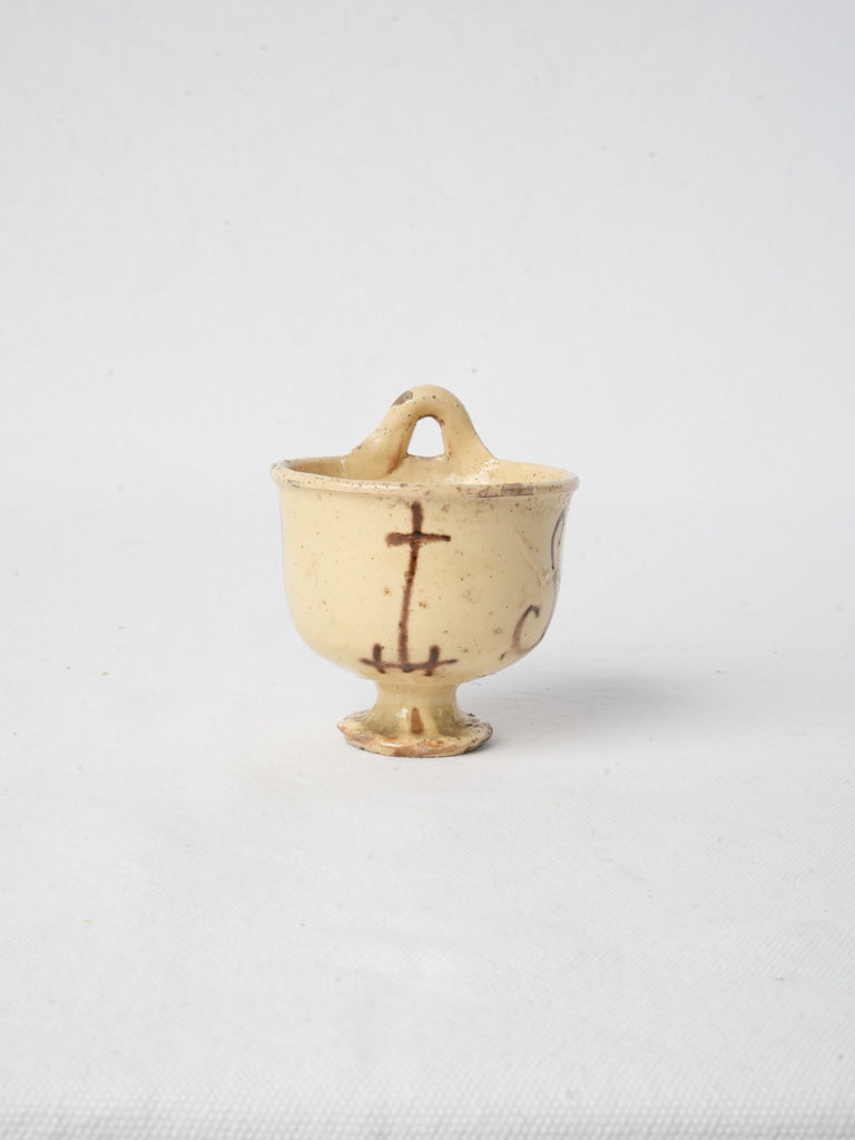 Vintage straw-cream earthenware font