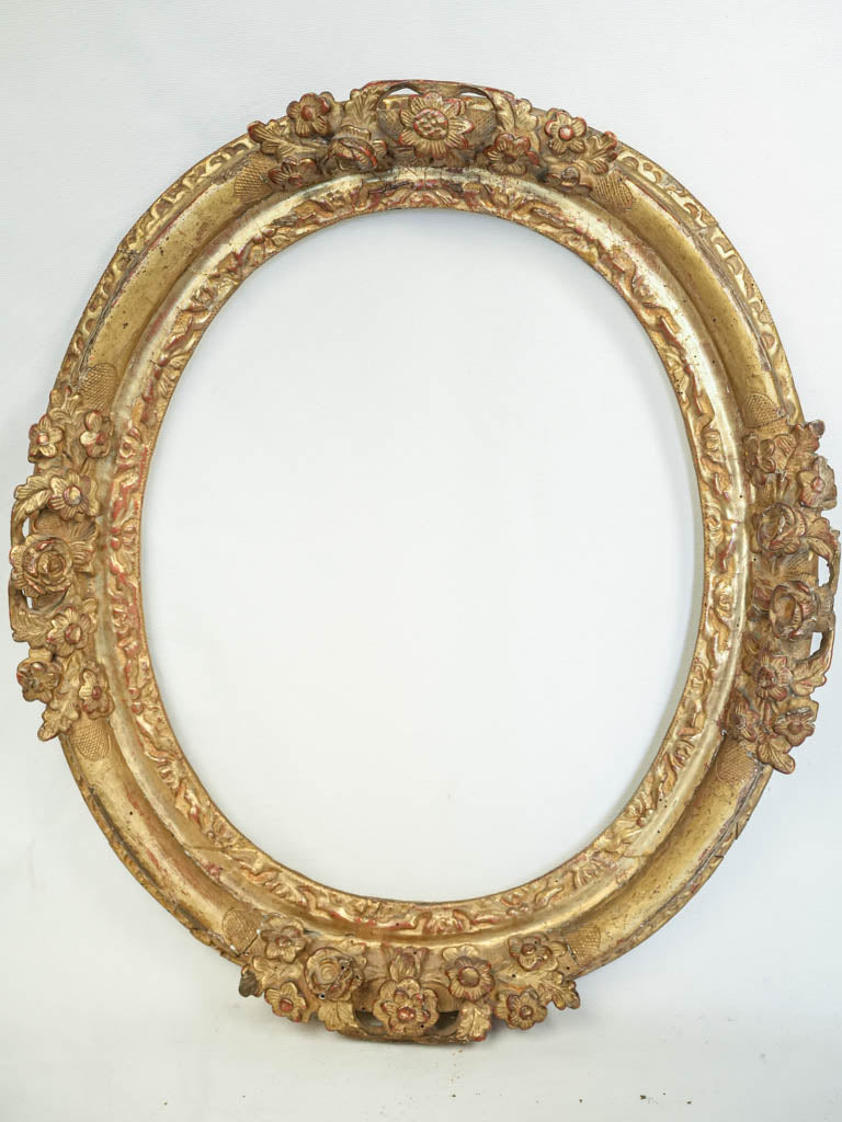 Ornate gilded oak oval frame