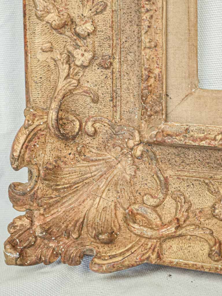 Sculptural motif adorned frame