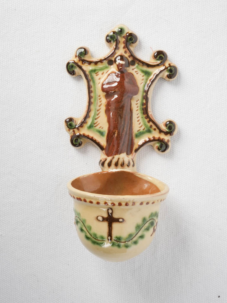Glazed terracotta saint relief