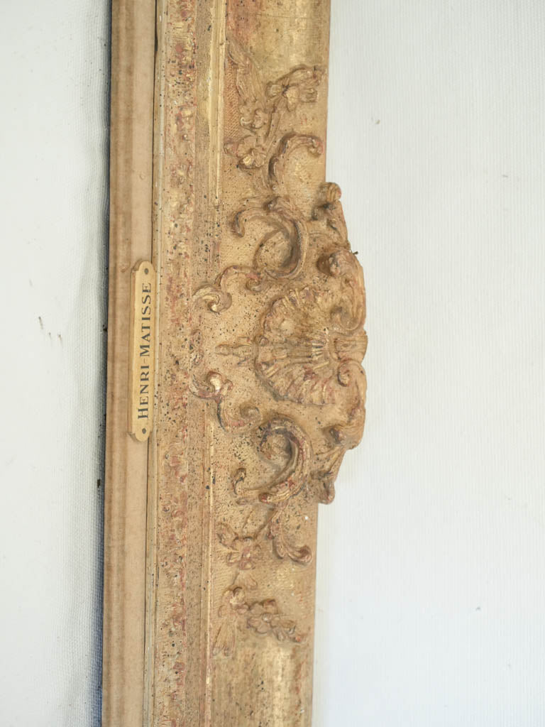 Discreet brass-labeled frame