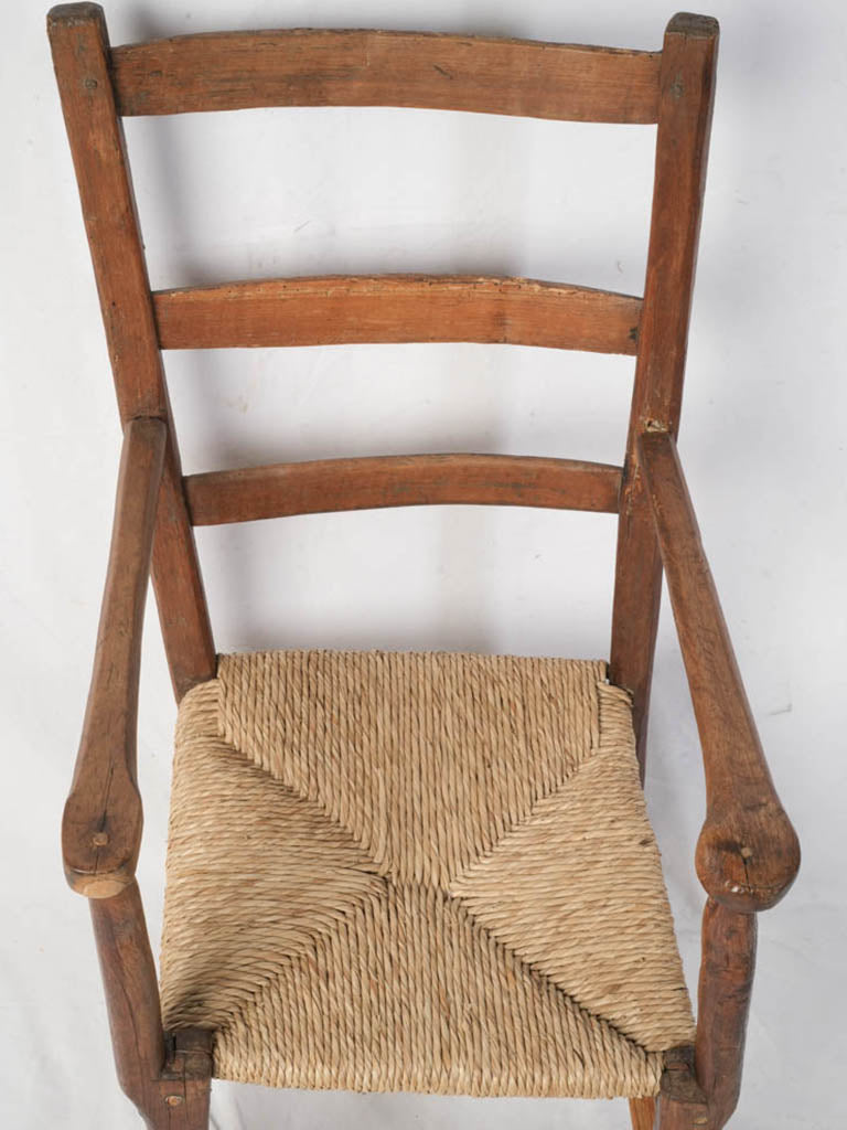 Patinated wooden armchair