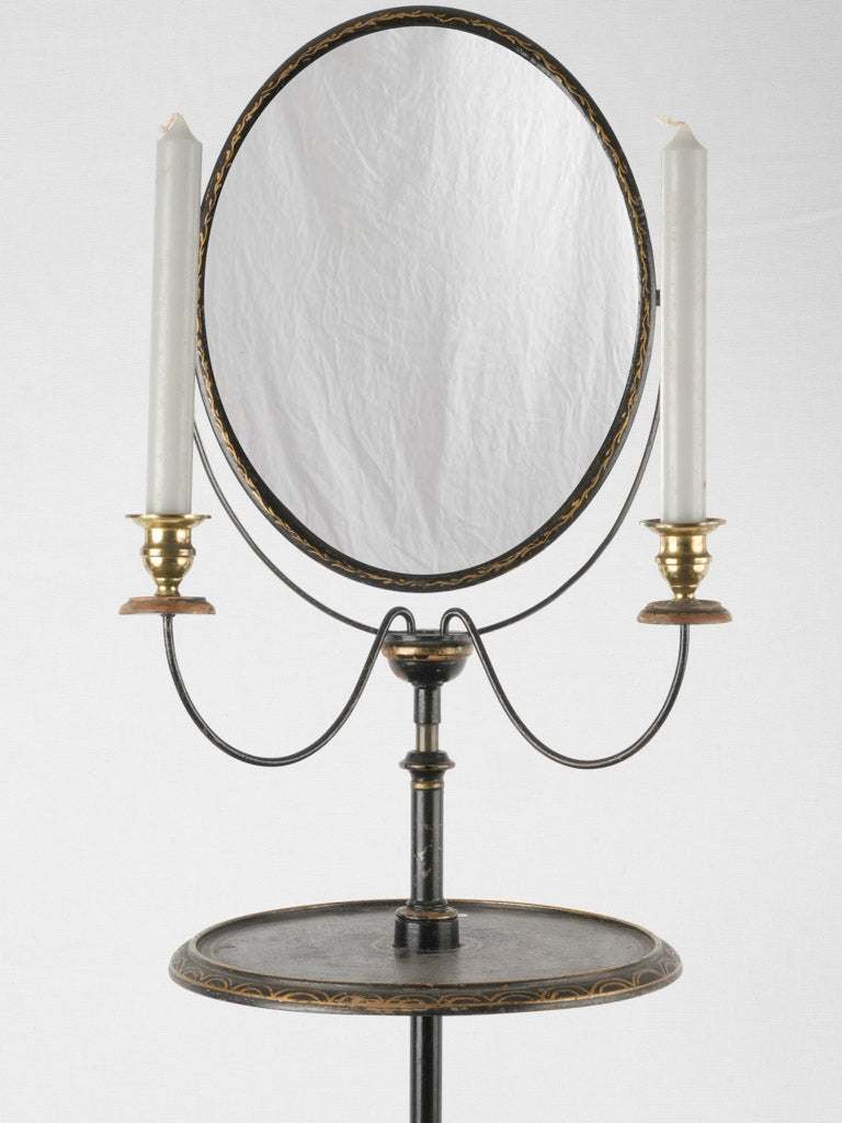 Decorative black and gold framed mirror