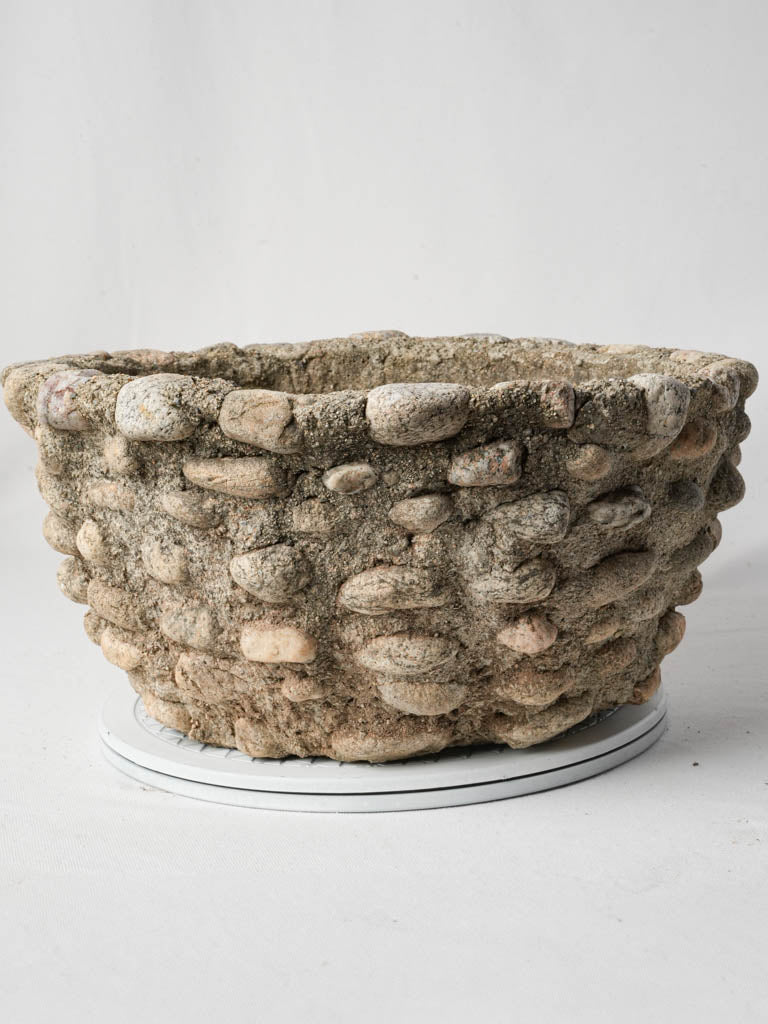 Rustic moss-covered outdoor planter  