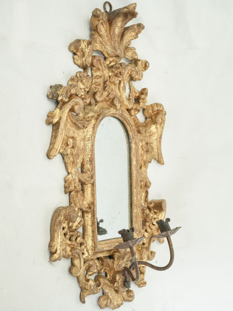 Ornate 17th-century mercury glass reflector