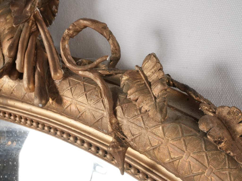Gilded ornamental mirror foliage details