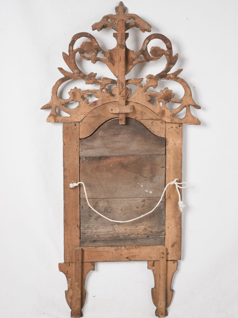 Elegant ornamental giltwood statement mirror