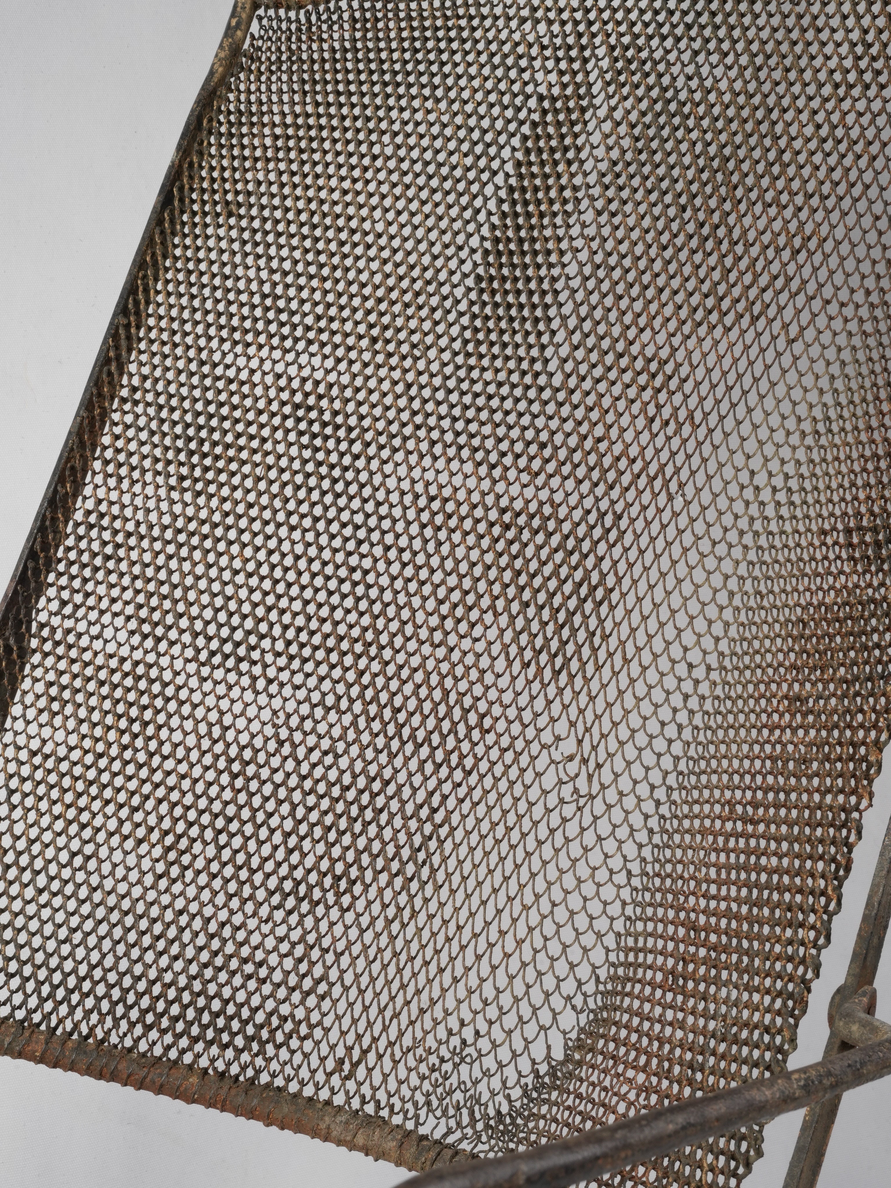 Charming richly textured iron chair