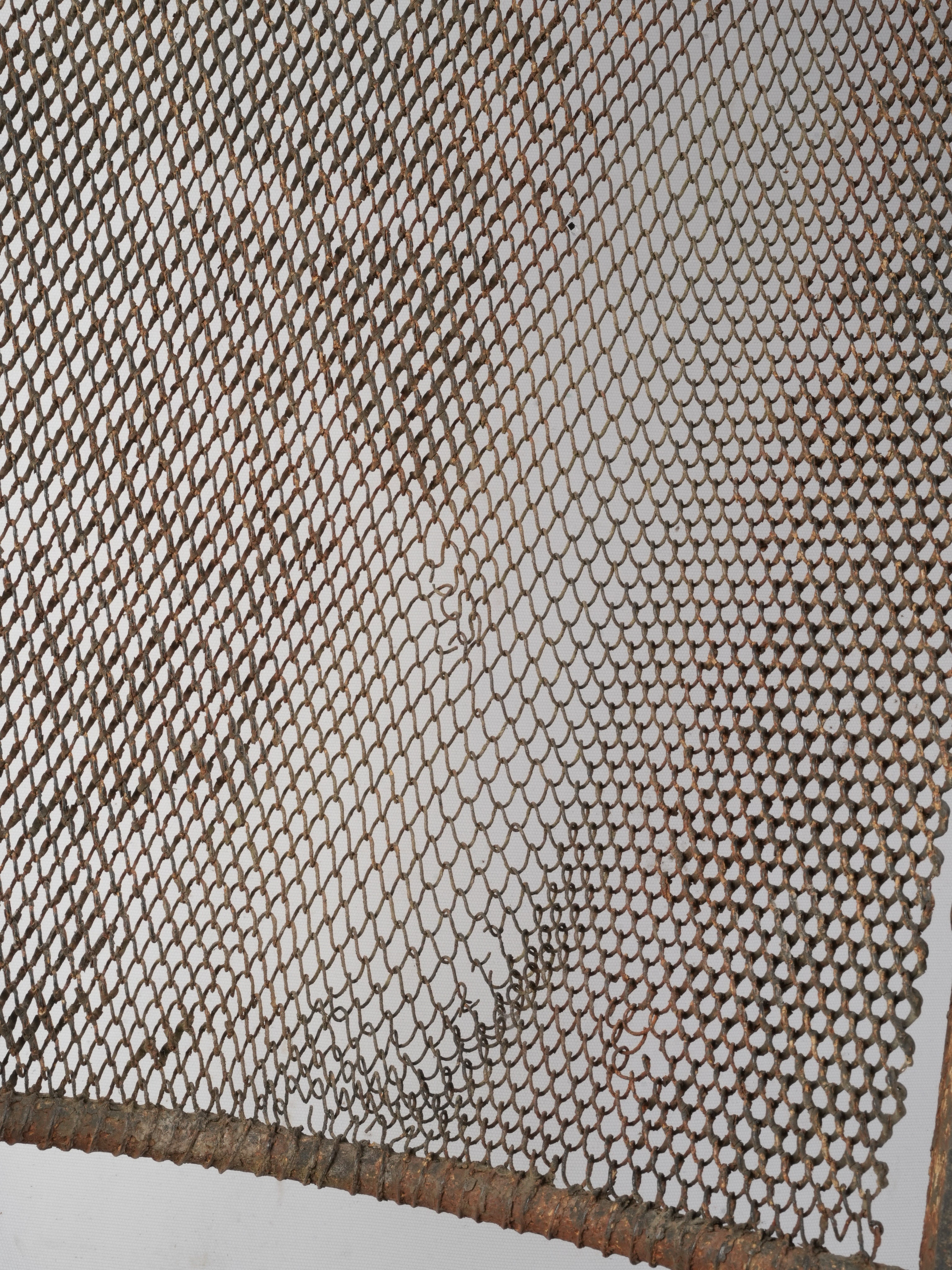 Ornate scrolled finials iron armchair